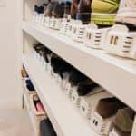 white shoe slotz on white shelves with shoes